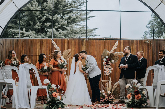 Arch florals and matching aisle arrangements